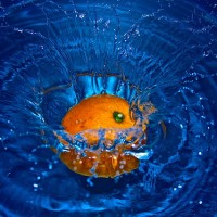 Orange Falling in Water - Image