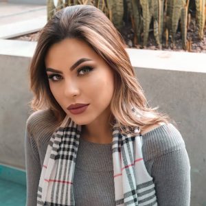 Woman in Plaid Scarf - Image